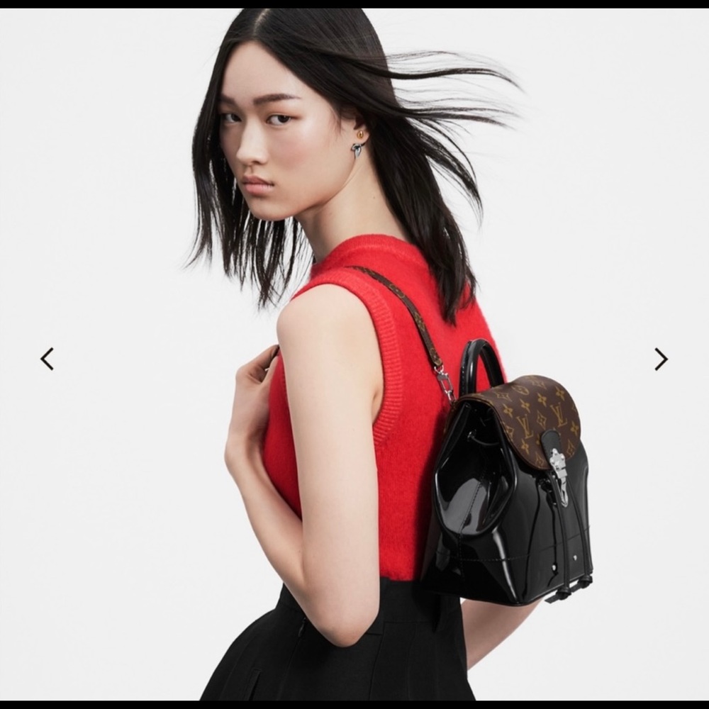 LV Mini Hot Springs Mini-Backpack in patent leather and Monogram canvas.